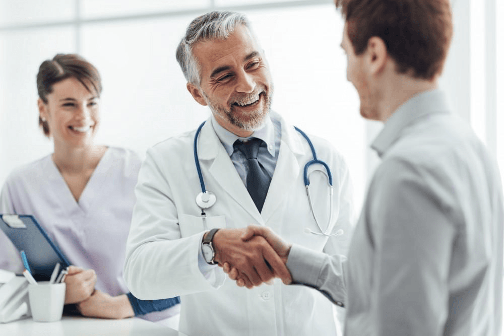 Medical professionals meeting with a patient